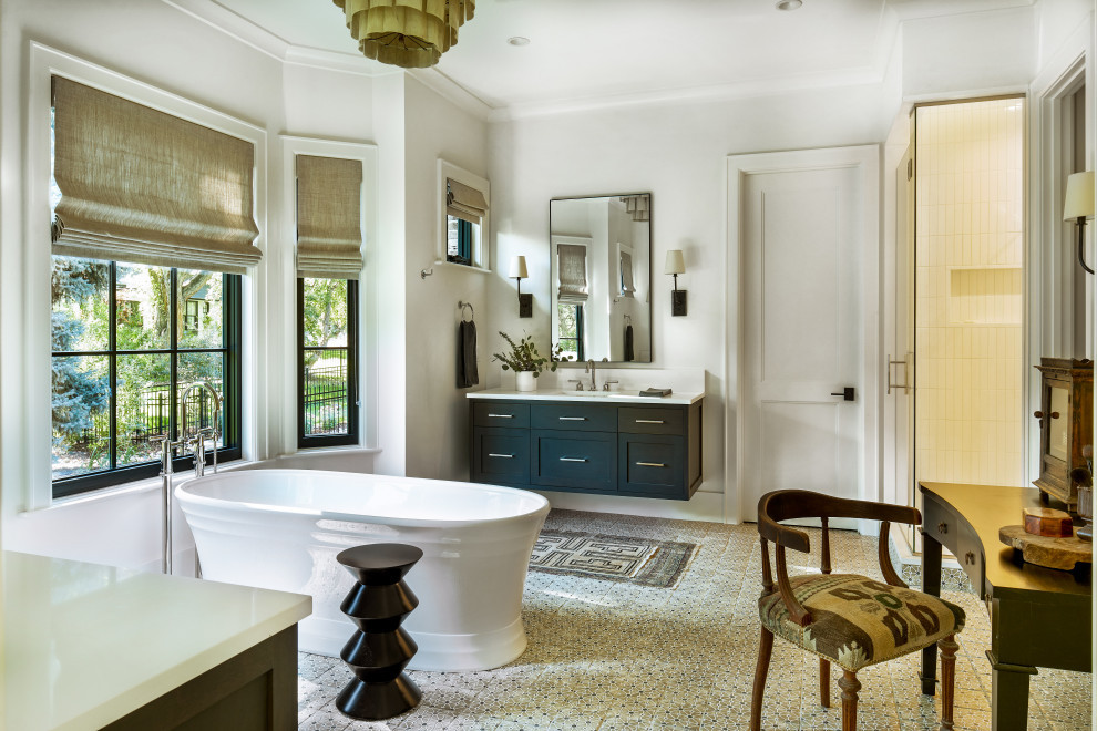 Timeless Traditional Bathroom with Bright Light, White Bathtub & Dark Cabinetry
