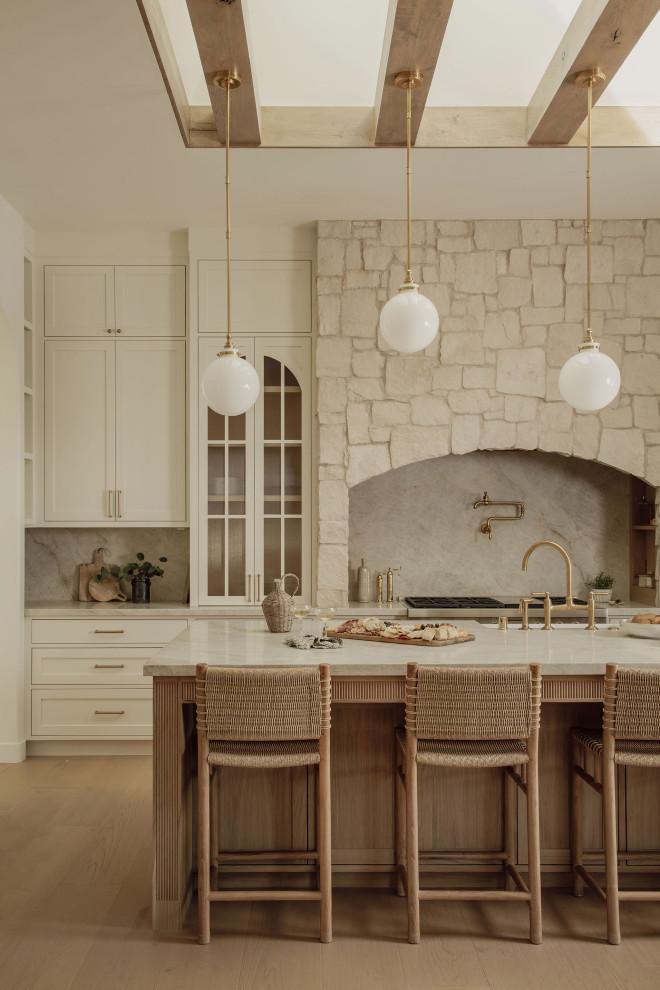 Sunlit Rustic Farmhouse Kitchen: Wood Beams, Stone & Woven Stools