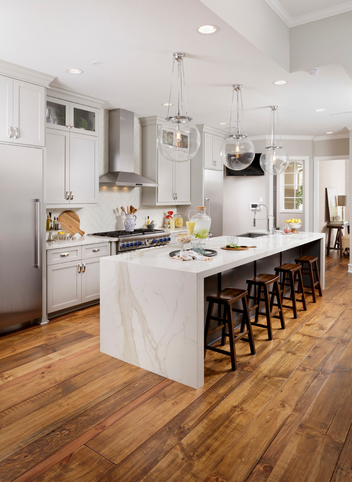 Sleek Modern Kitchen with Marbled Island & Natural Light