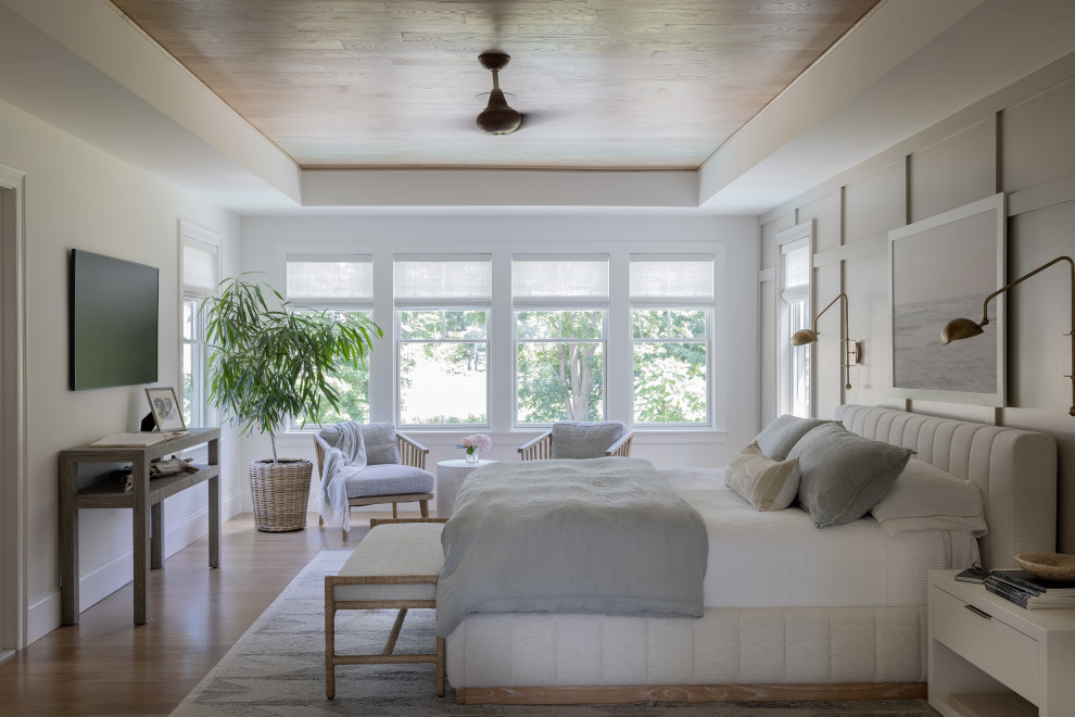 Sunlight-Filled Modern Bedroom with Cozy Bed & Seating Corner