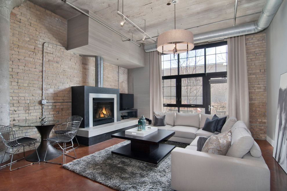 Modern Industrial Loft Living Room: Exposed Brick & Cozy Fireplace