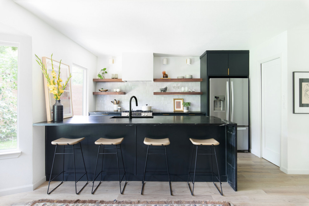 Sleek Modern Kitchen: Black Island, White Cabinetry, & Natural Light