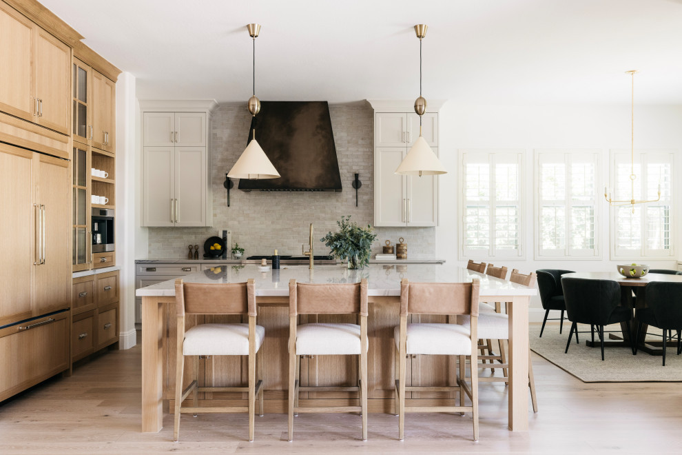 Scandinavian Modern Open Kitchen & Dining Space with Wood and Light