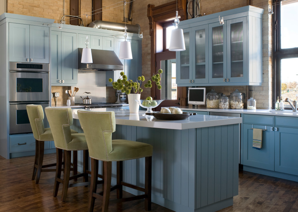 Sunlit Farmhouse Industrial Kitchen with Light Blue Cabinets & Island